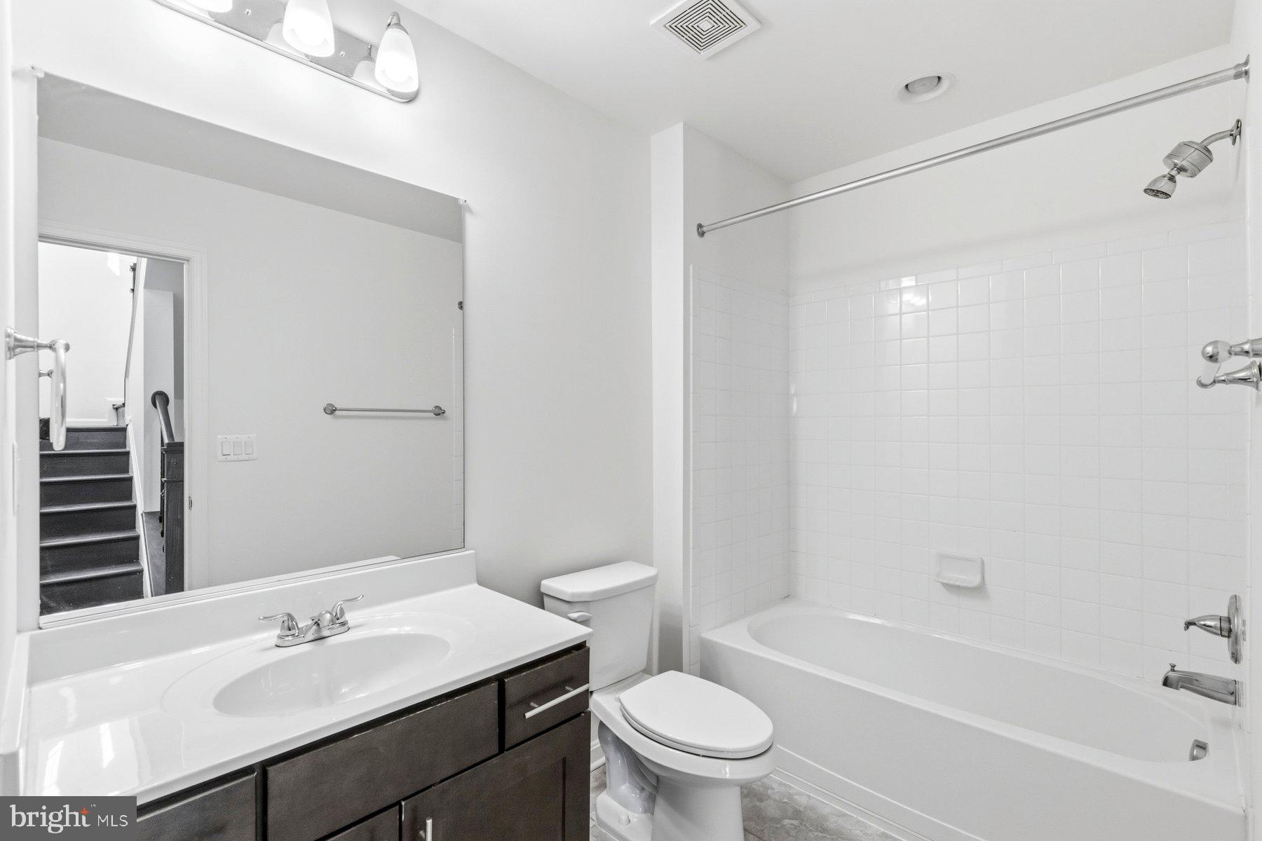 7205 Barry Lane Elkridge, MD 21075 - Photo 16 of 22 a bathroom with a sink toilet and shower