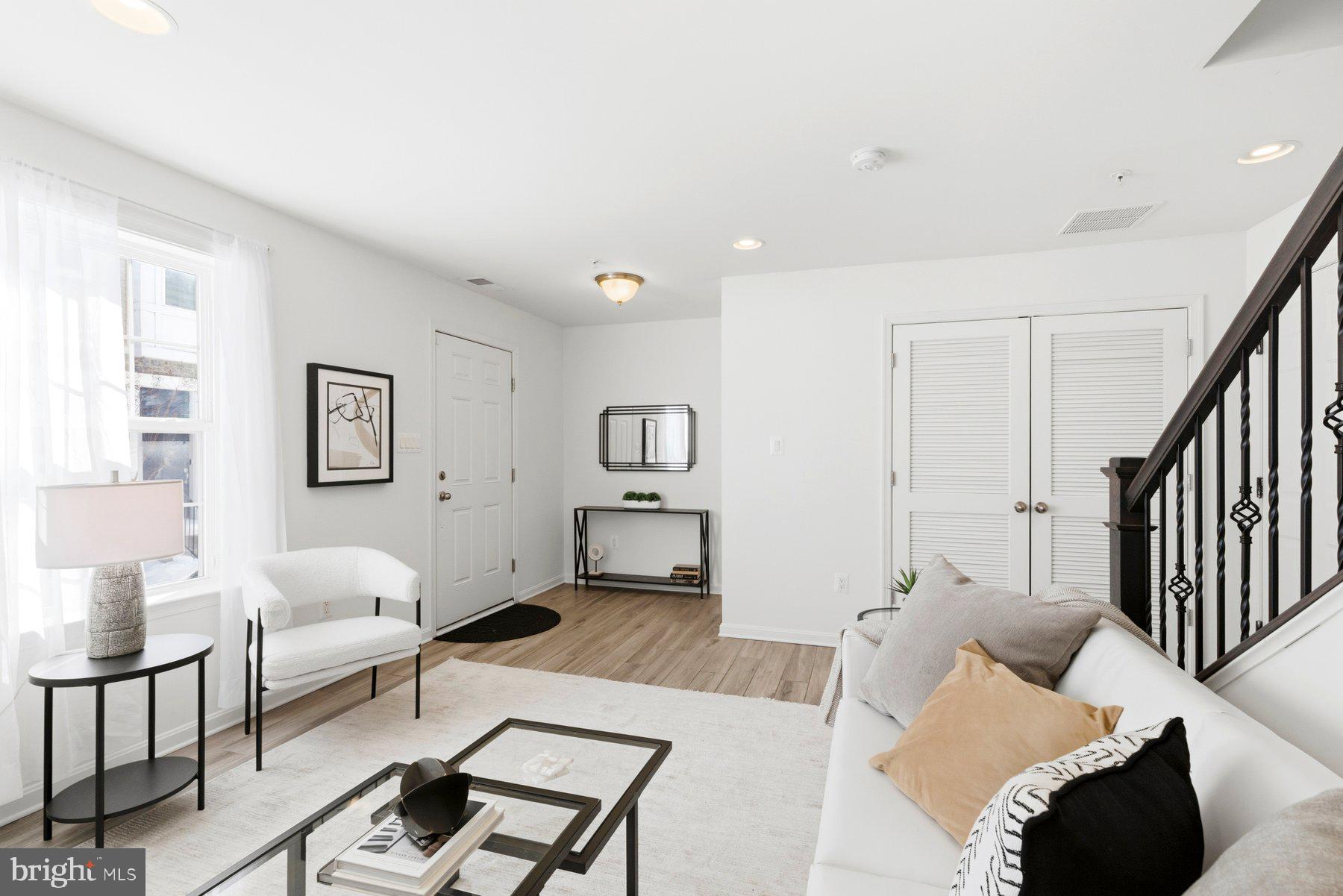 7205 Barry Lane Elkridge, MD 21075 - Photo 8 of 22 a living room with furniture and wooden floor