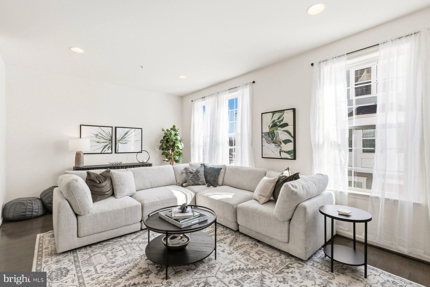 7205 Barry Lane Elkridge, MD 21075 - Photo 9 of 22 a living room with furniture and a large window