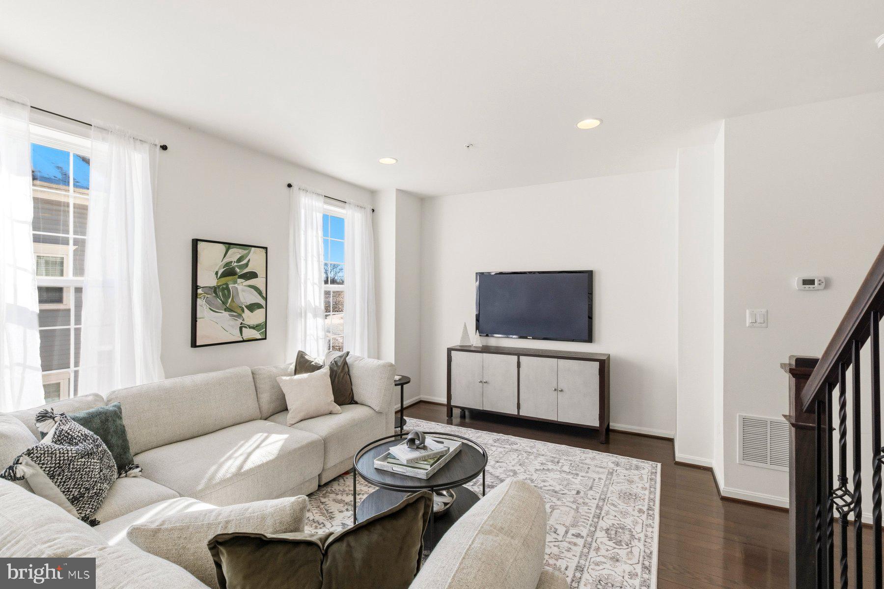 7205 Barry Lane Elkridge, MD 21075 - Photo 10 of 22 a living room with furniture and a flat screen tv