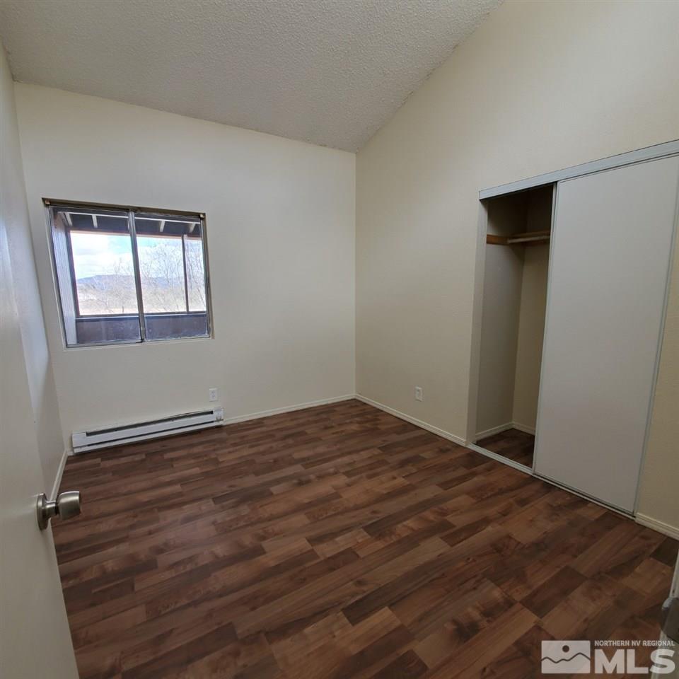 2085 Highview Court, Unit 4 Reno, NV 89512 - Photo 3 of 8 an empty room with windows
