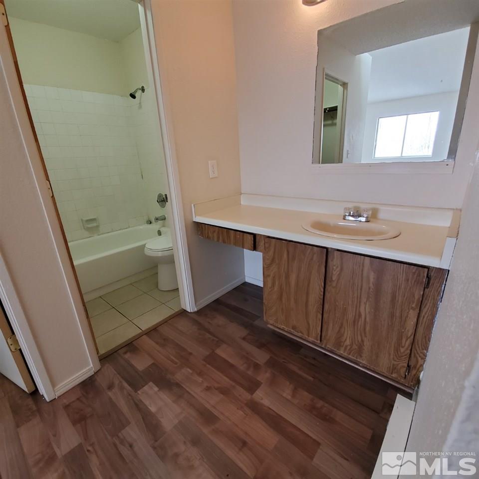 2085 Highview Court, Unit 4 Reno, NV 89512 - Photo 7 of 8 a bathroom with a sink and a mirror
