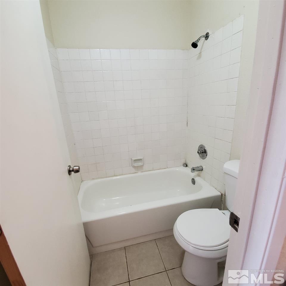 2085 Highview Court, Unit 4 Reno, NV 89512 - Photo 8 of 8 a bathroom with a toilet and a bathtub