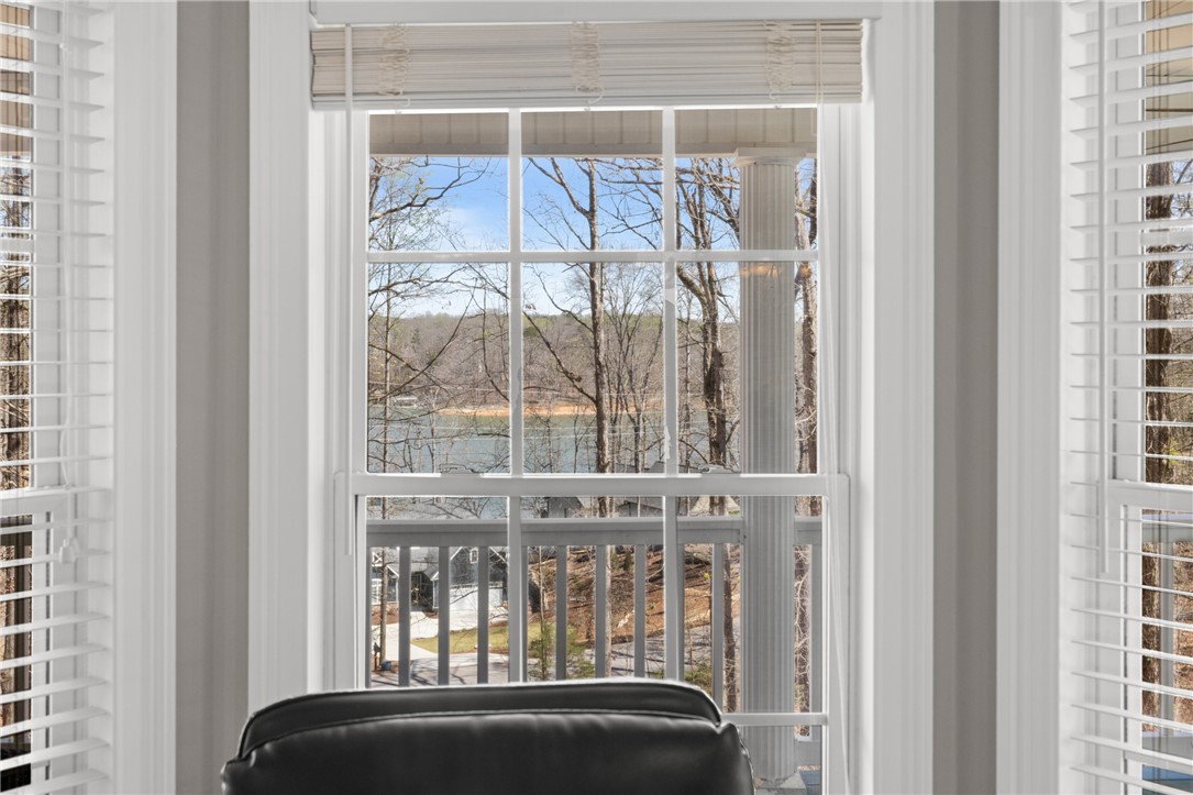 204 Riverlake Road Fair Play, SC 29643 - Photo 13 of 50 Enjoy tranquil water views from this expansive window, offering a serene escape.