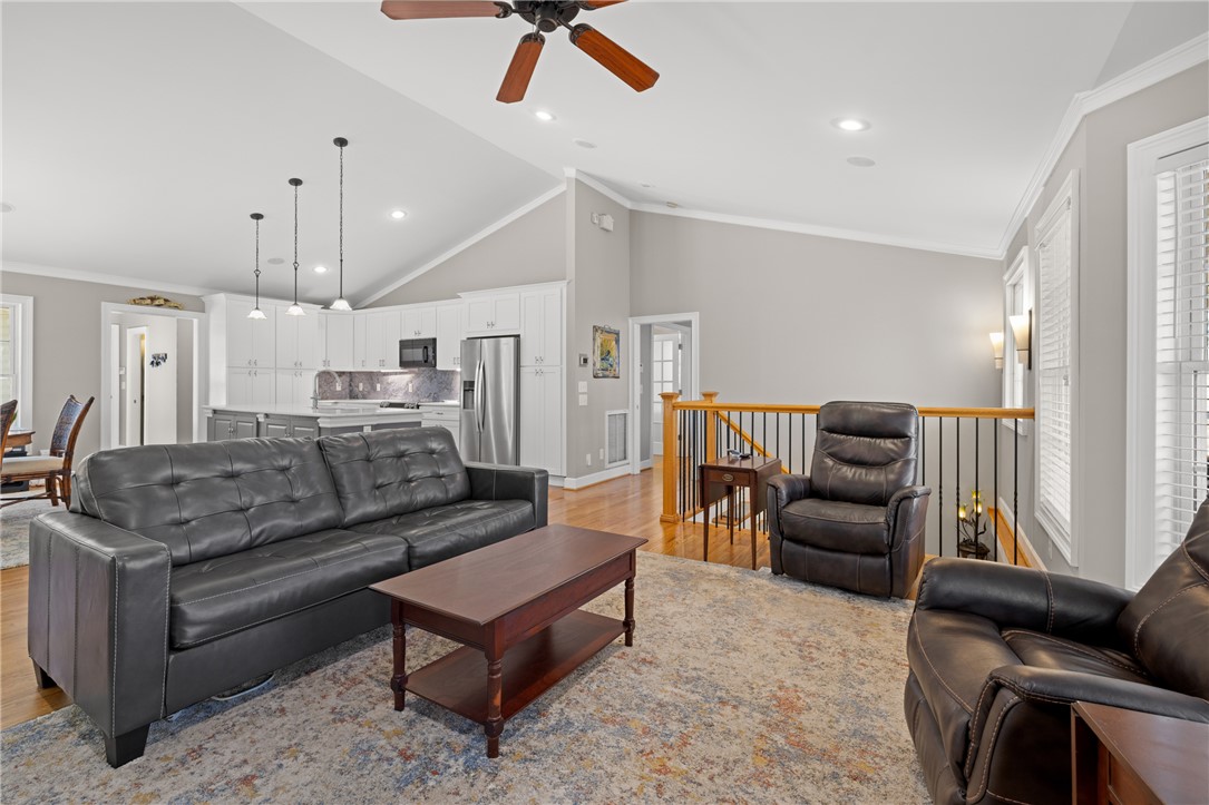 204 Riverlake Road Fair Play, SC 29643 - Photo 14 of 50 This inviting space features an open-concept design and high vaulted ceilings, perfect for comfortable living.