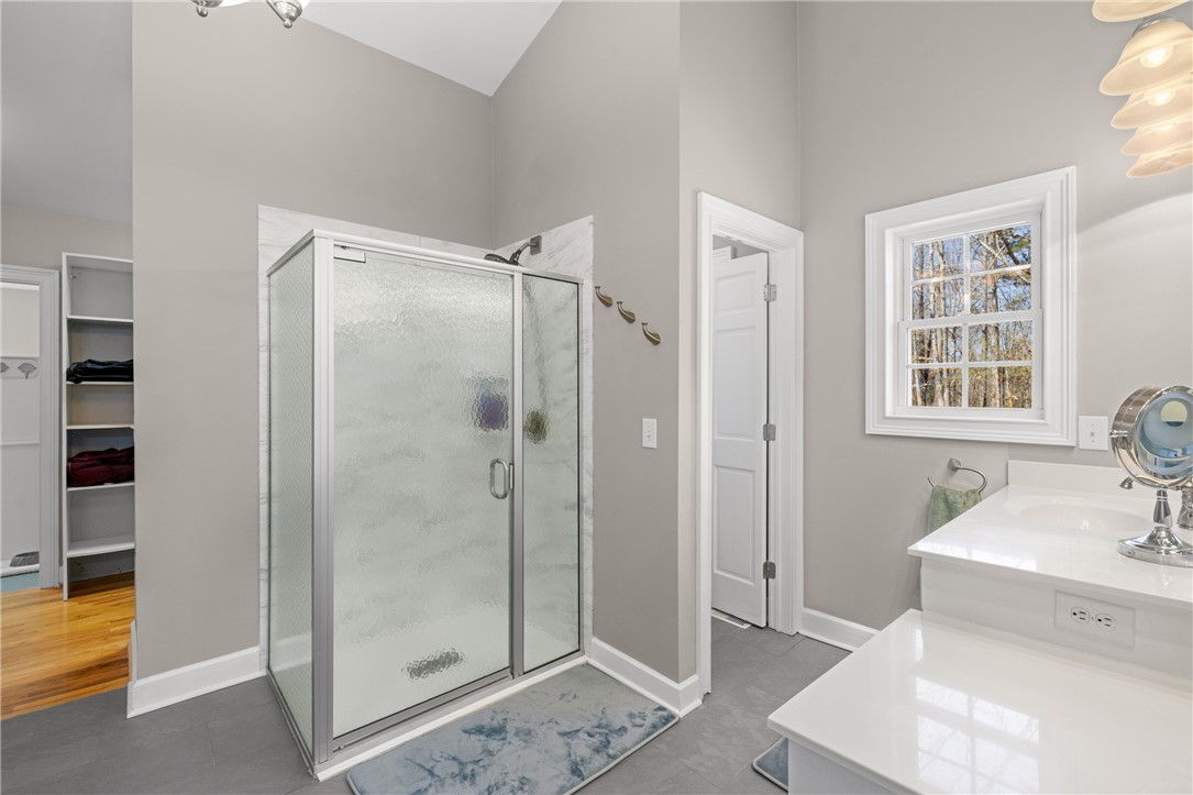 204 Riverlake Road Fair Play, SC 29643 - Photo 17 of 50 This bathroom features a sleek shower and bright vanity, offering a clean and functional design.