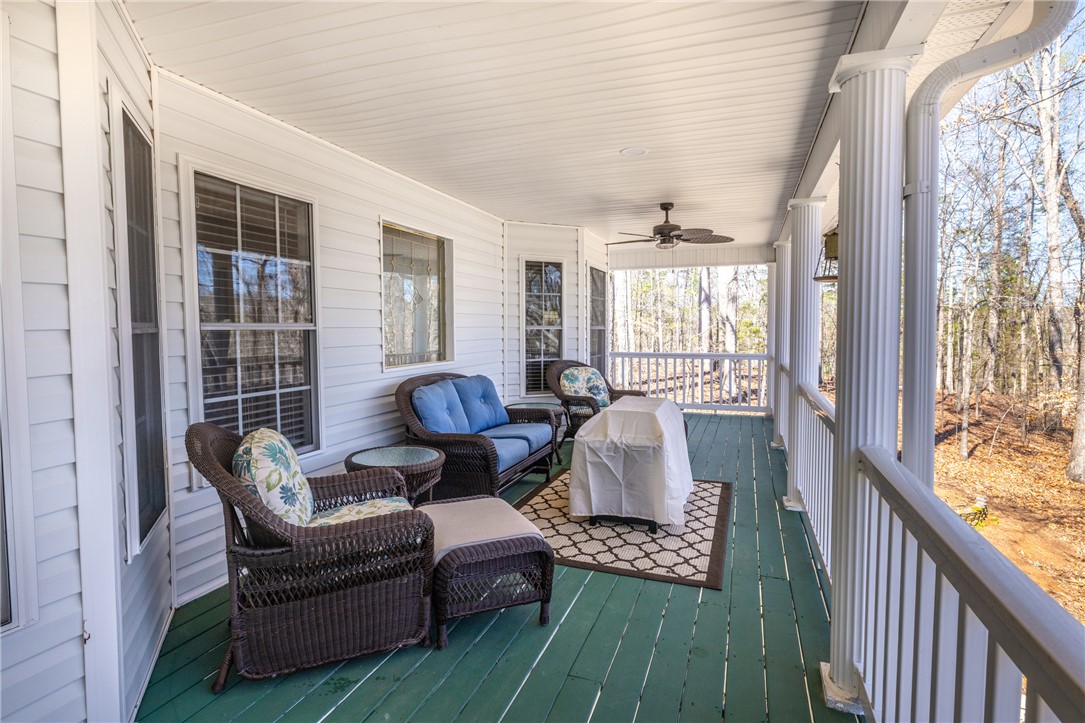 204 Riverlake Road Fair Play, SC 29643 - Photo 27 of 50 Enjoy tranquil woodland views from this inviting and expansive porch, perfect for relaxation.