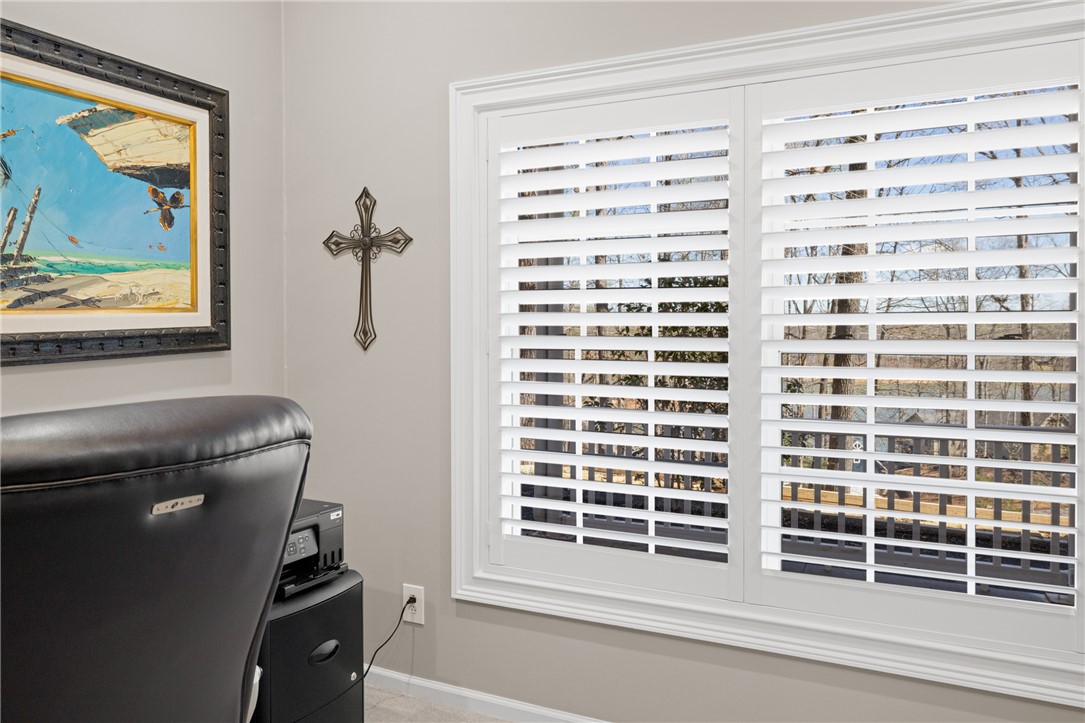 204 Riverlake Road Fair Play, SC 29643 - Photo 34 of 50 This dedicated workspace provides privacy and natural light, fostering productivity and comfort.