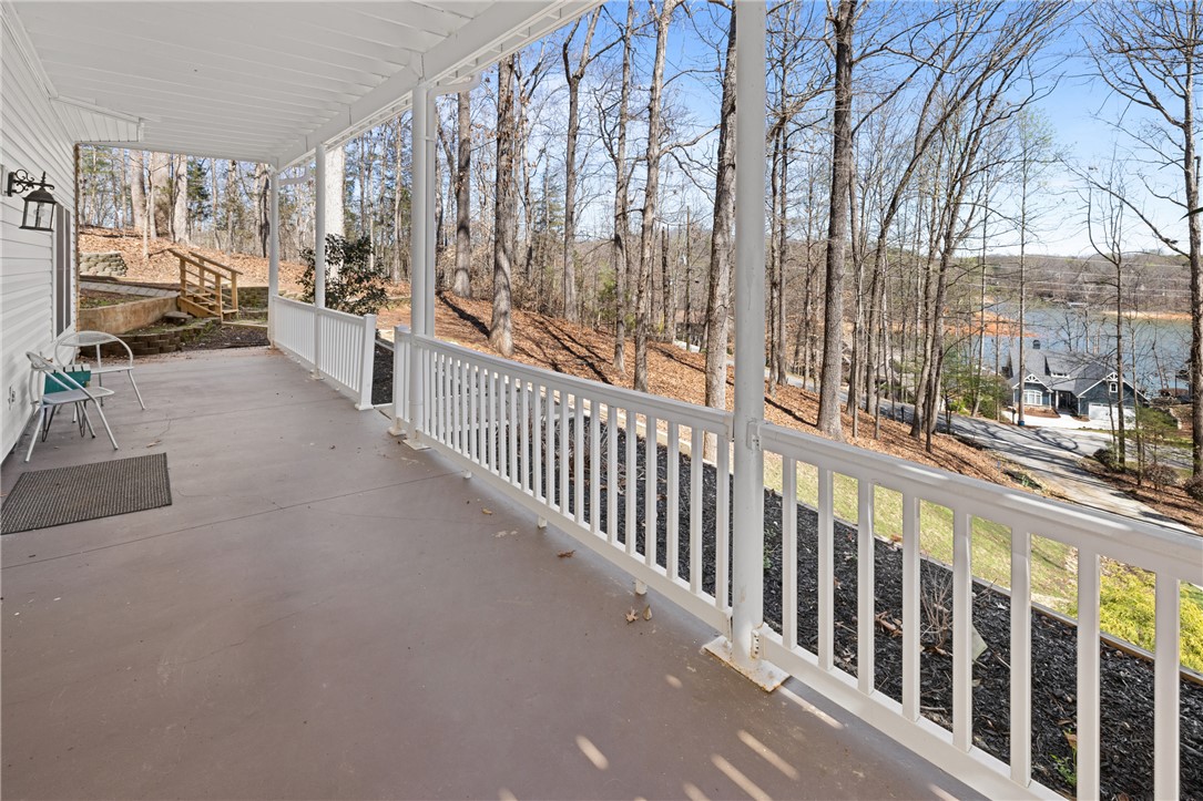 204 Riverlake Road Fair Play, SC 29643 - Photo 37 of 50 Enjoy tranquil lake views from this inviting porch, perfect for peaceful mornings and relaxing evenings.