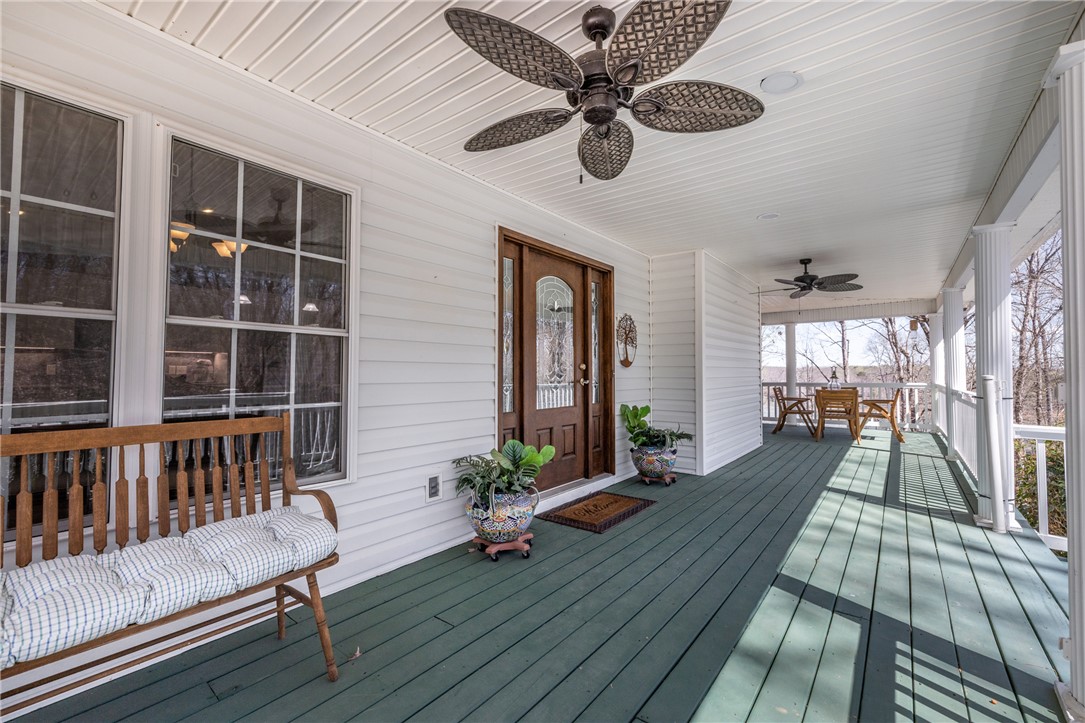 204 Riverlake Road Fair Play, SC 29643 - Photo 4 of 50 This inviting porch offers comfortable outdoor living with ample space for relaxation and entertaining.