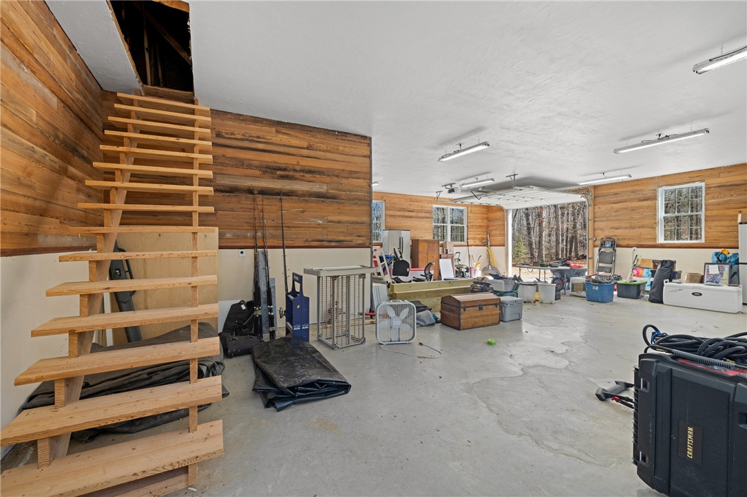 204 Riverlake Road Fair Play, SC 29643 - Photo 41 of 50 This spacious interior offers an abundance of functional space with rustic wood paneling.