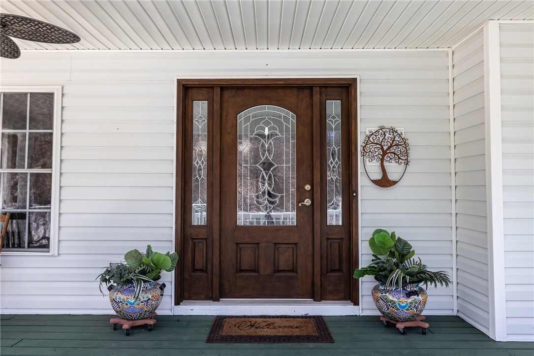 204 Riverlake Road Fair Play, SC 29643 - Photo 5 of 50 This charming front entry features a rich wooden door with decorative glass.