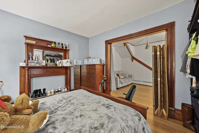 a bed room with a bed and a dresser