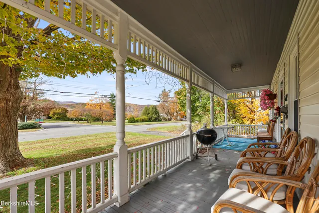 a view of swimming pool with seating space