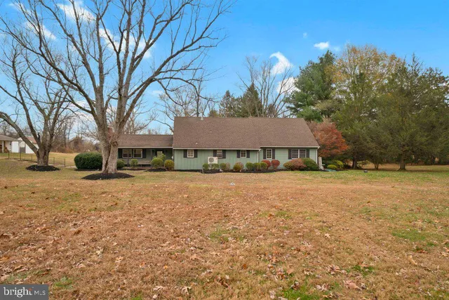 a house with trees in front of it
