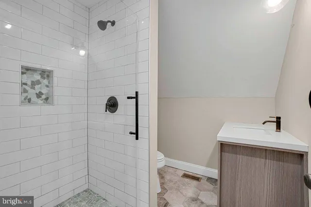 a bathroom with a sink and shower