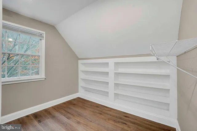 a bathroom with a sink a shower and a mirror