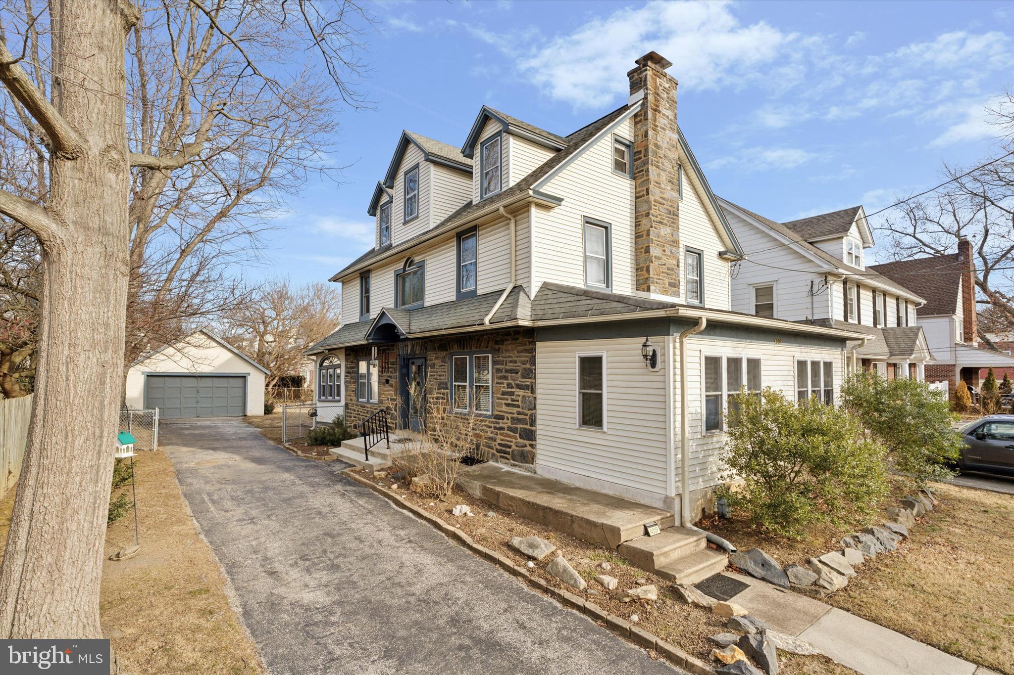 4009 State Road Drexel Hill, PA 19026 - Photo 1 of 26 a view of a white house with large windows next to a road