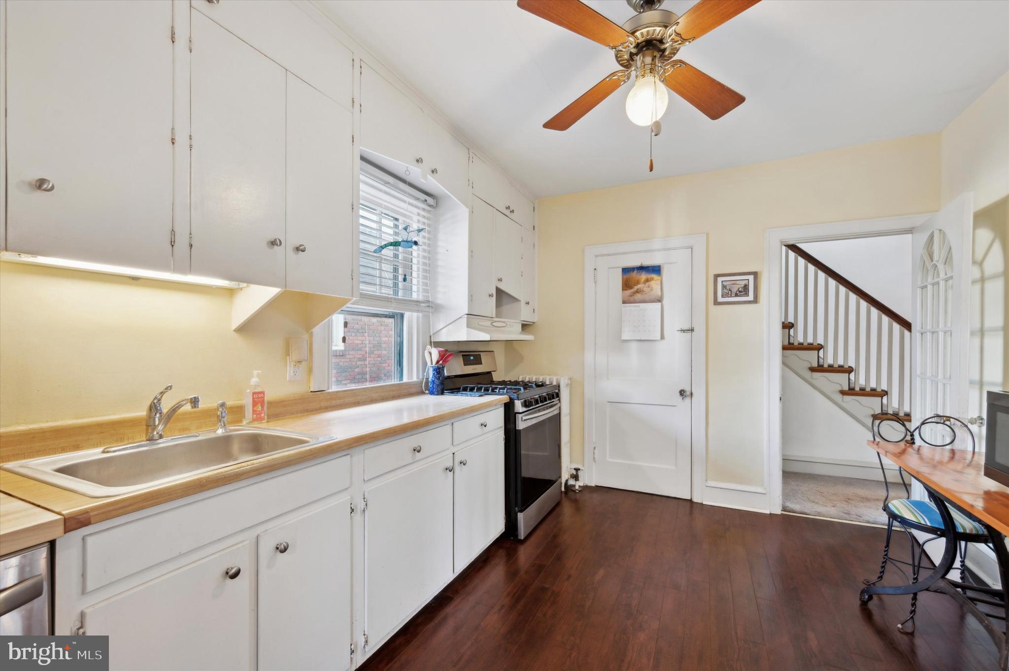 4009 State Road Drexel Hill, PA 19026 - Photo 12 of 26 a kitchen with a sink cabinets and wooden floor