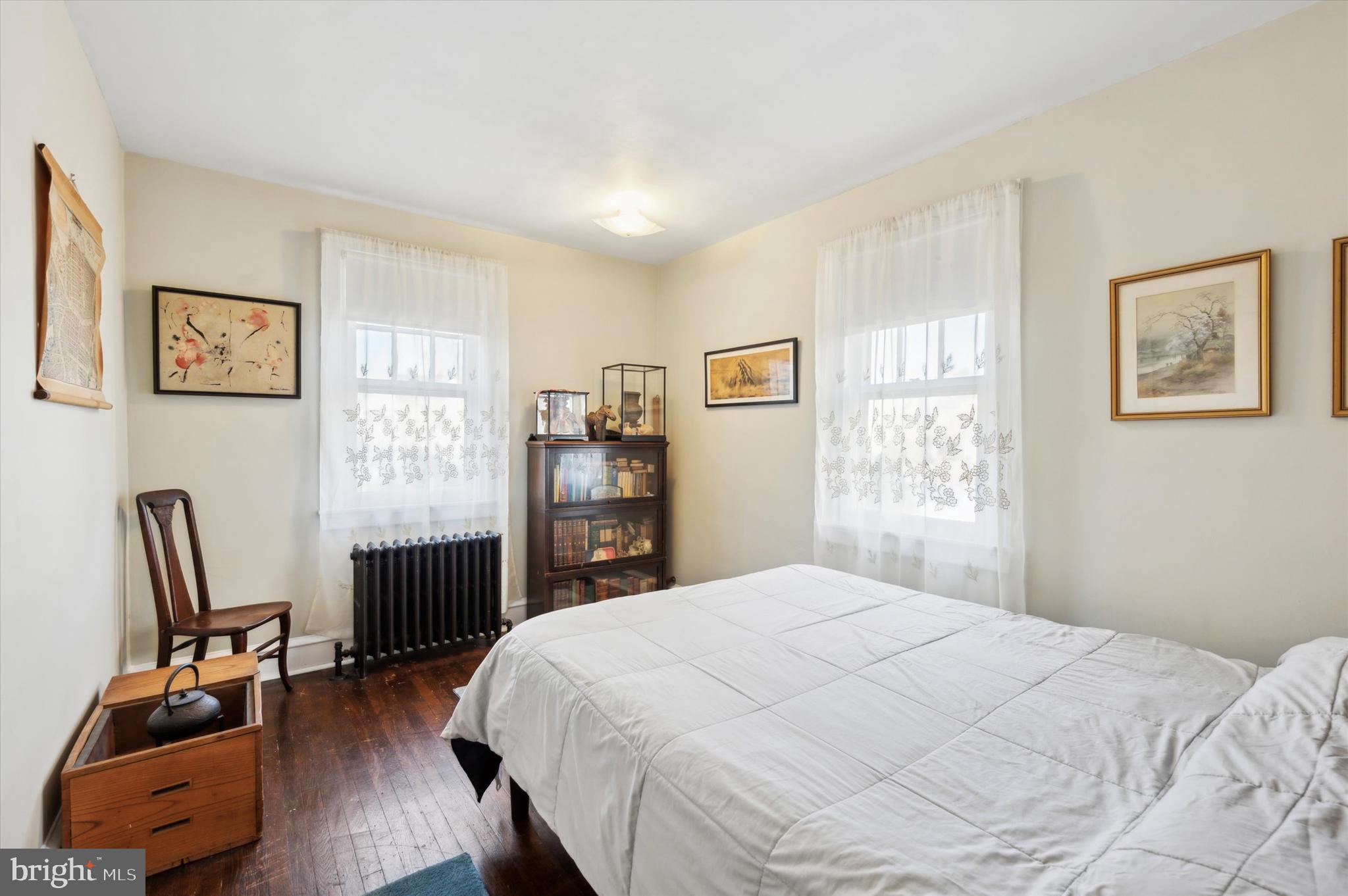 4009 State Road Drexel Hill, PA 19026 - Photo 17 of 26 a bedroom with a bed and a chair in it