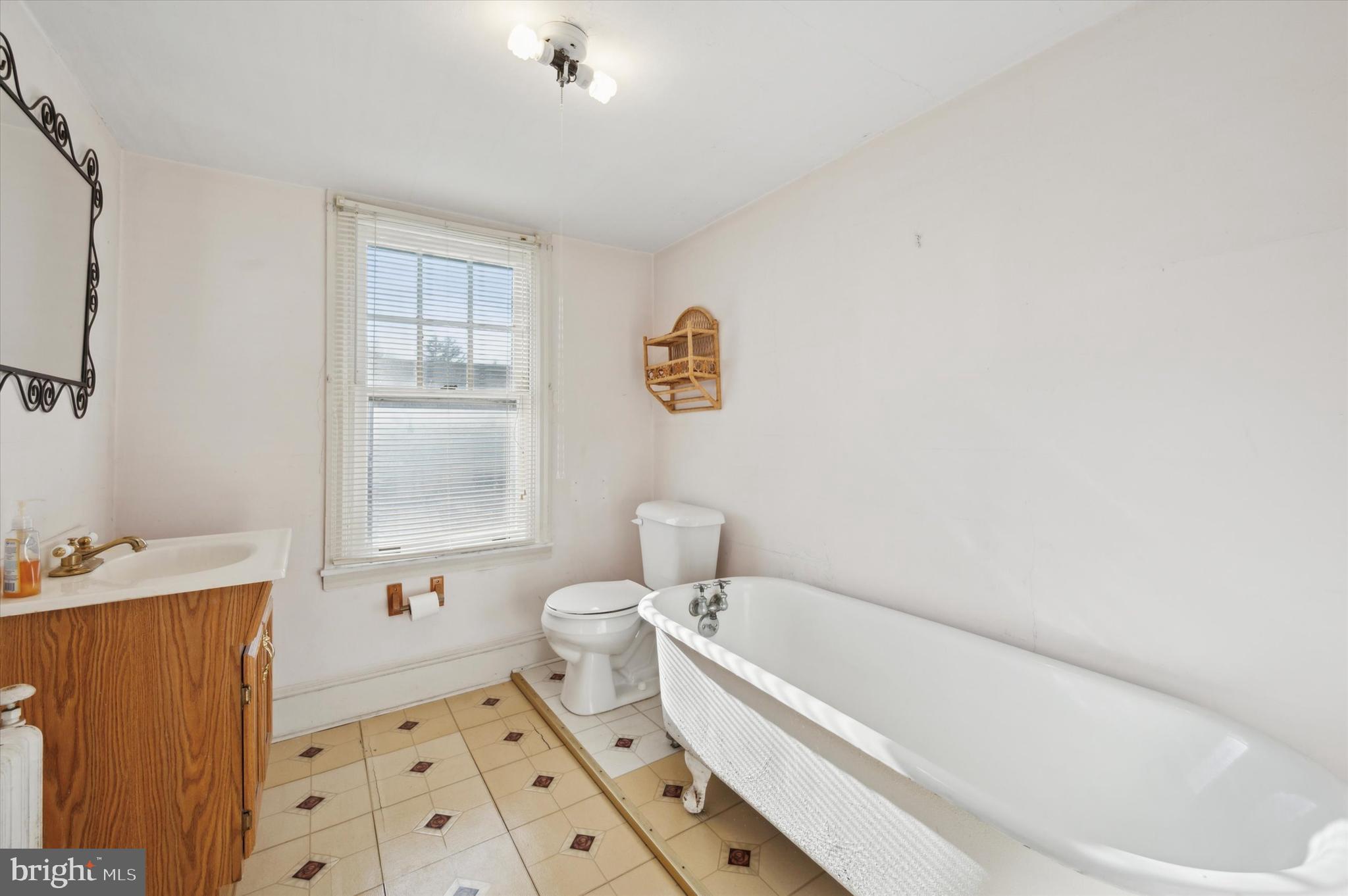 4009 State Road Drexel Hill, PA 19026 - Photo 23 of 26 a bathroom with a sink a toilet and a bath tub