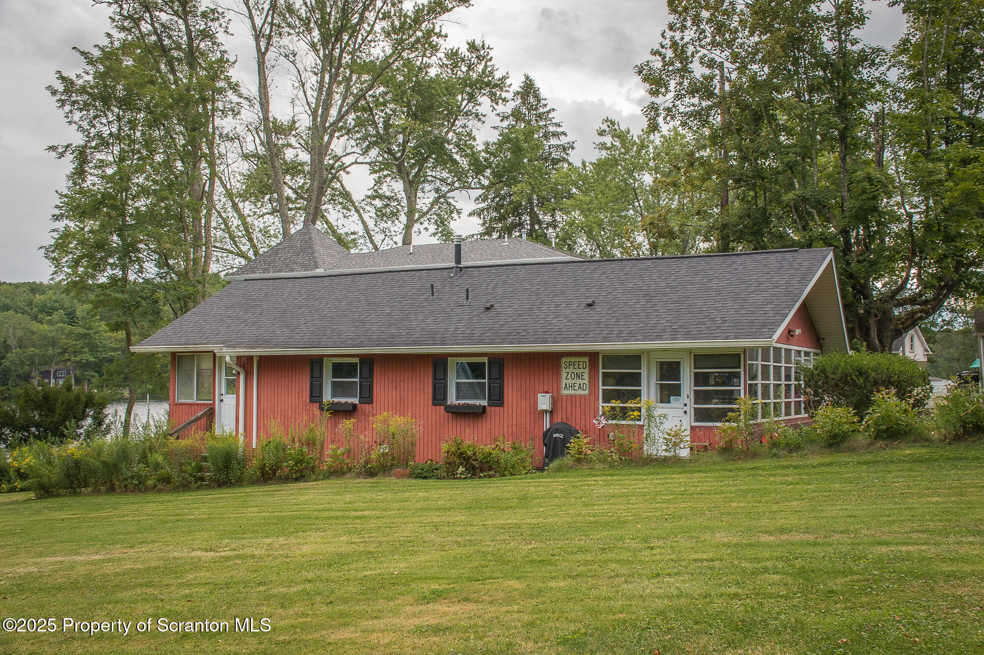 260 Baylors Lake Road Fleetville, PA 18420 - Photo 16 of 69 a front view of a house with a garden