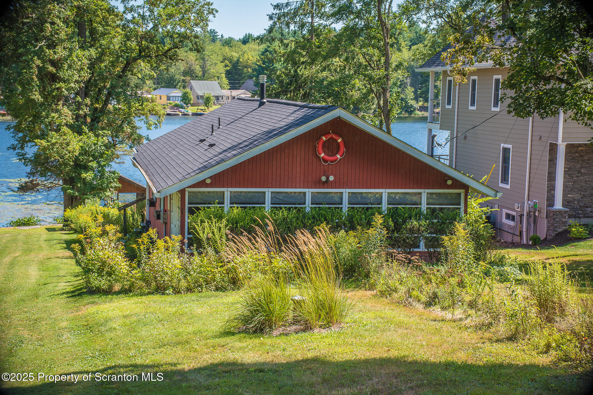 260 Baylors Lake Road Fleetville, PA 18420 - Photo 2 of 69 a view of a house with garden