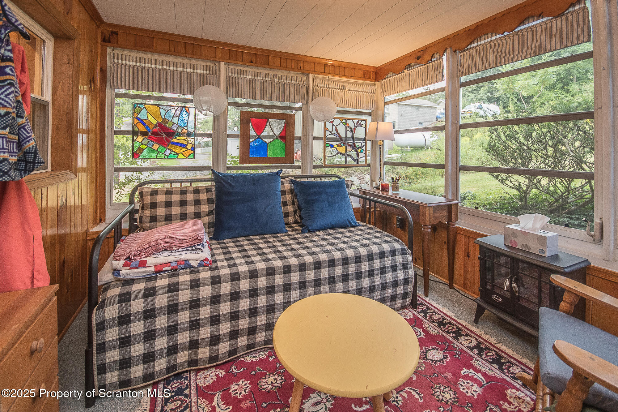 260 Baylors Lake Road Fleetville, PA 18420 - Photo 24 of 69 a living room with a couch and a table