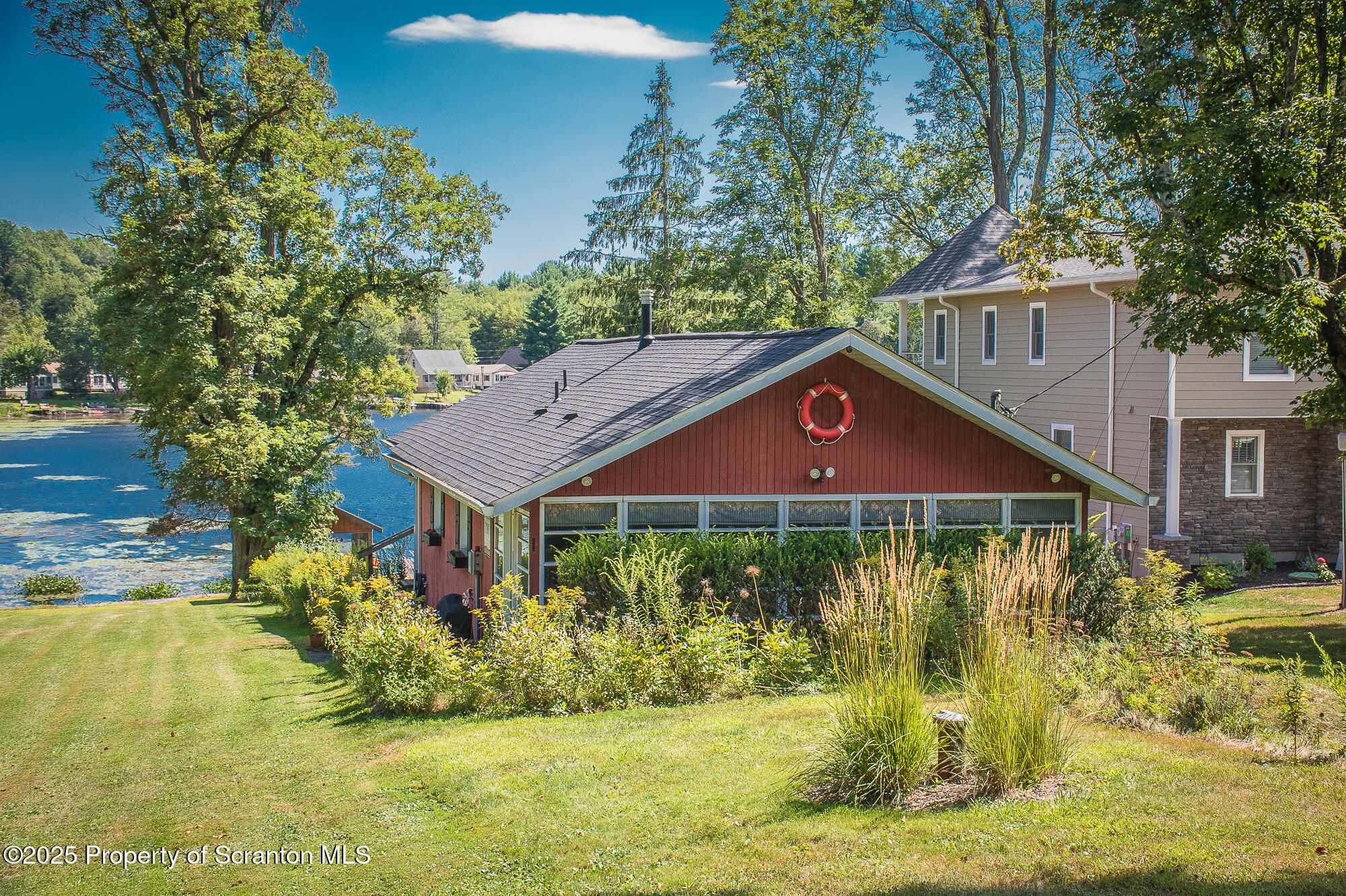 260 Baylors Lake Road Fleetville, PA 18420 - Photo 3 of 69 a front view of a house with a yard