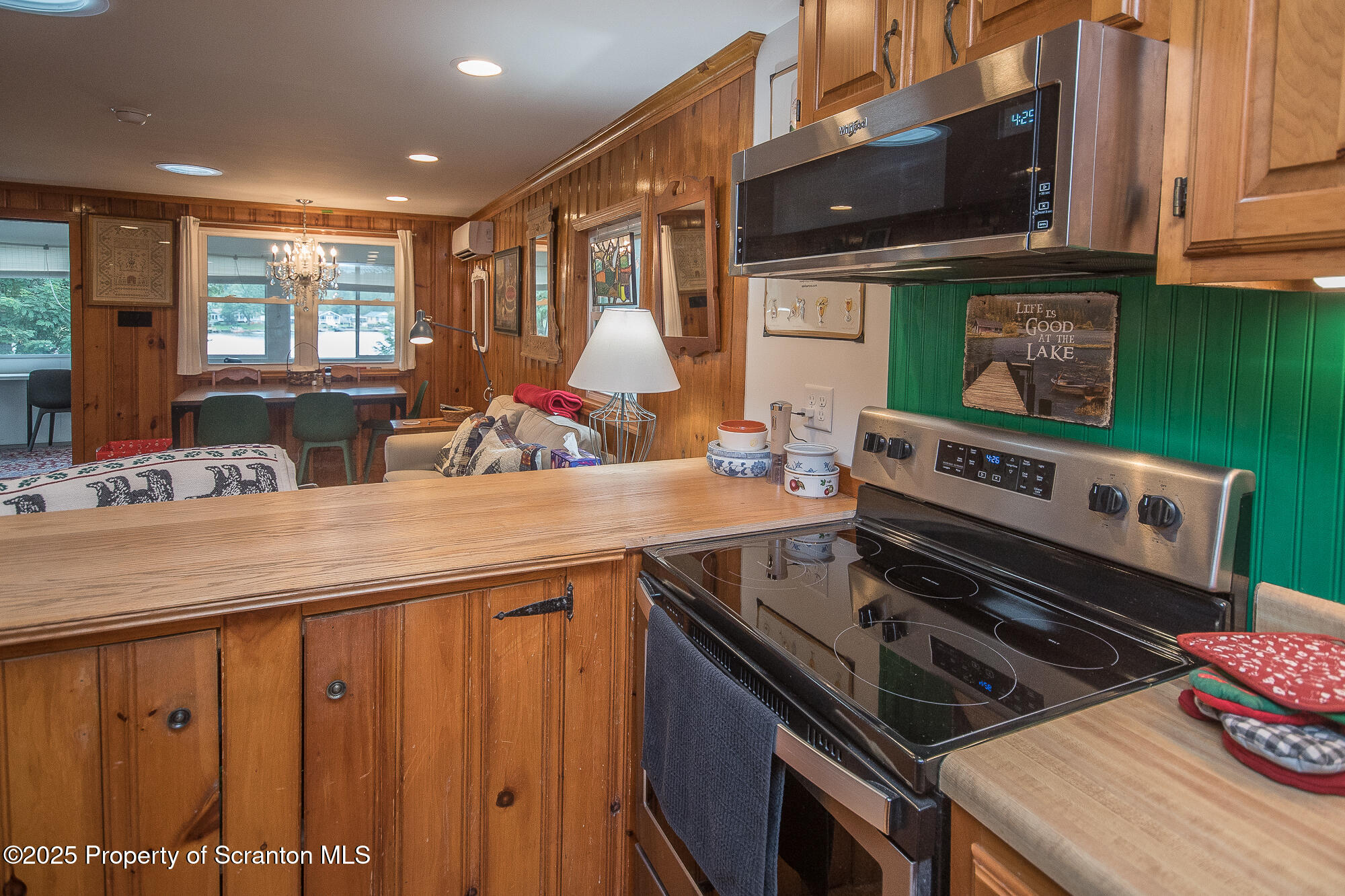 260 Baylors Lake Road Fleetville, PA 18420 - Photo 32 of 69 a kitchen with a stove a sink and a microwave