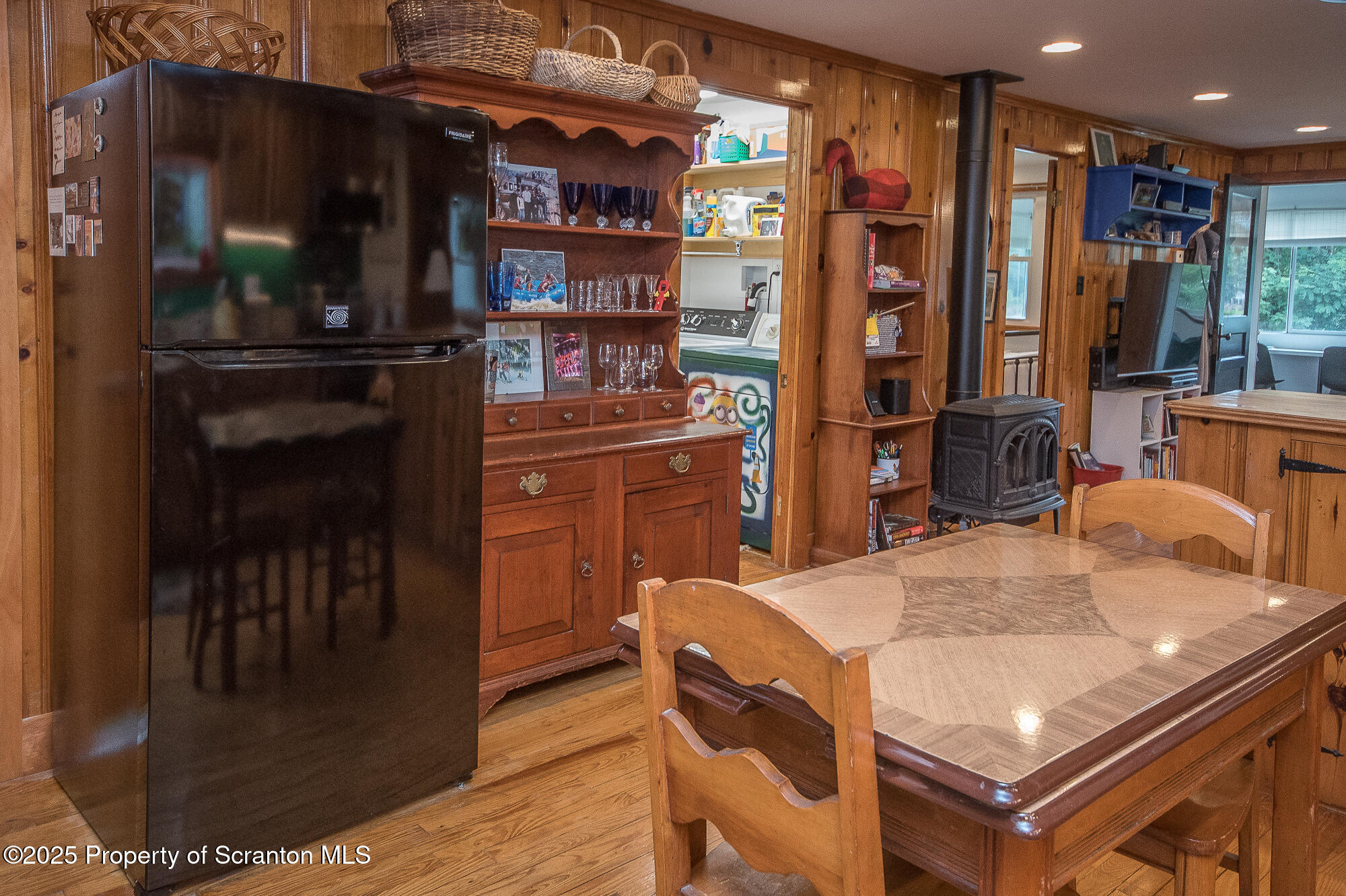 260 Baylors Lake Road Fleetville, PA 18420 - Photo 35 of 69 a kitchen with stainless steel appliances kitchen island granite countertop a refrigerator a stove and a sink with wooden floor