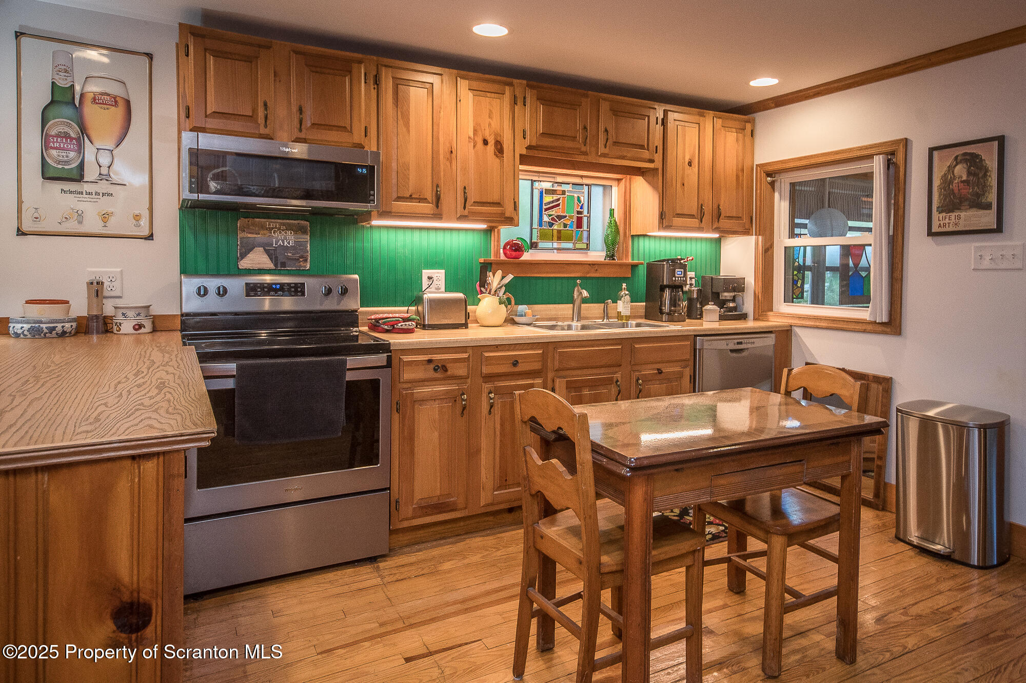 260 Baylors Lake Road Fleetville, PA 18420 - Photo 36 of 69 a kitchen with stainless steel appliances granite countertop a stove a sink dishwasher and a refrigerator
