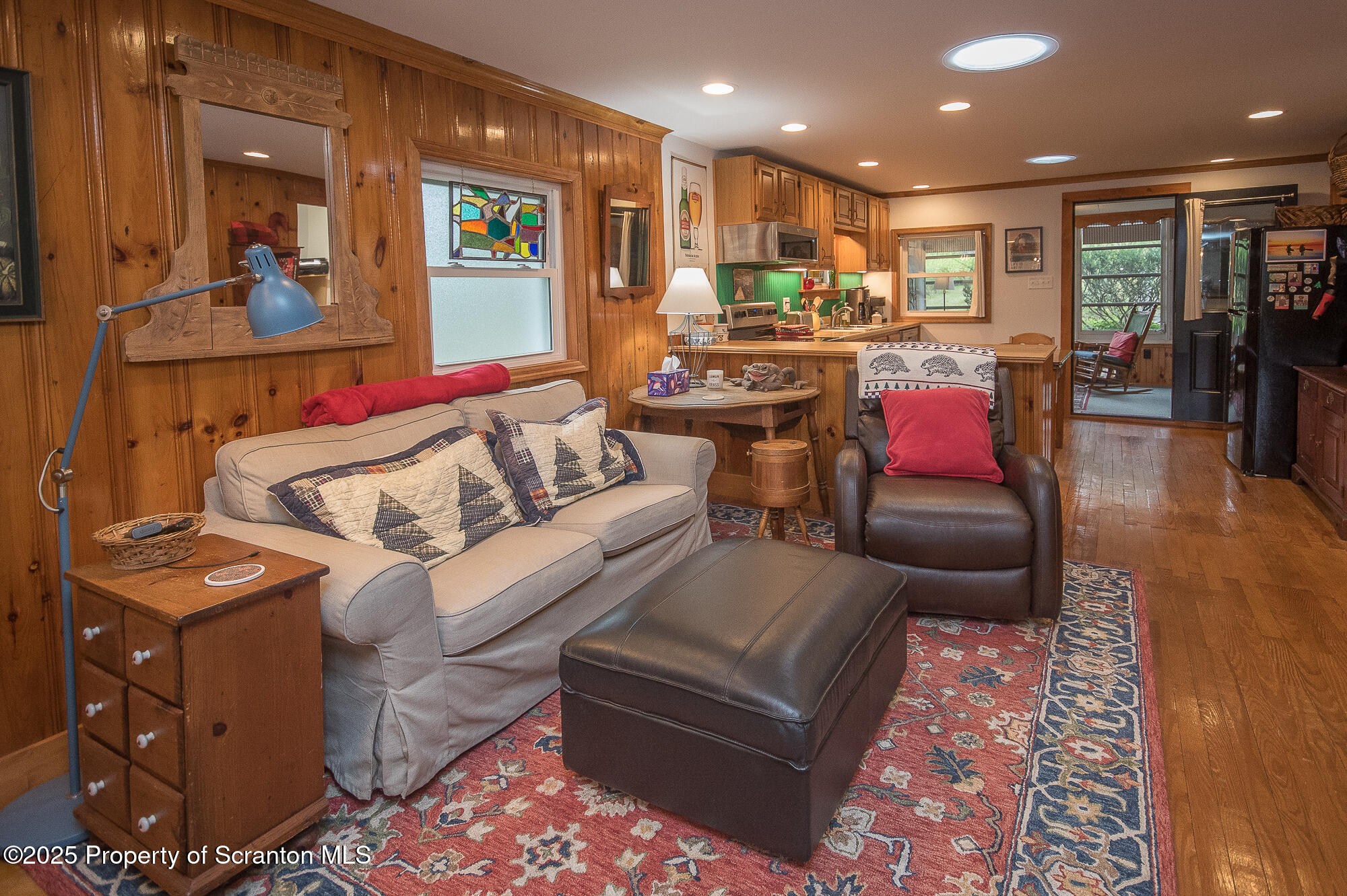 260 Baylors Lake Road Fleetville, PA 18420 - Photo 37 of 69 a living room with furniture and a flat screen tv