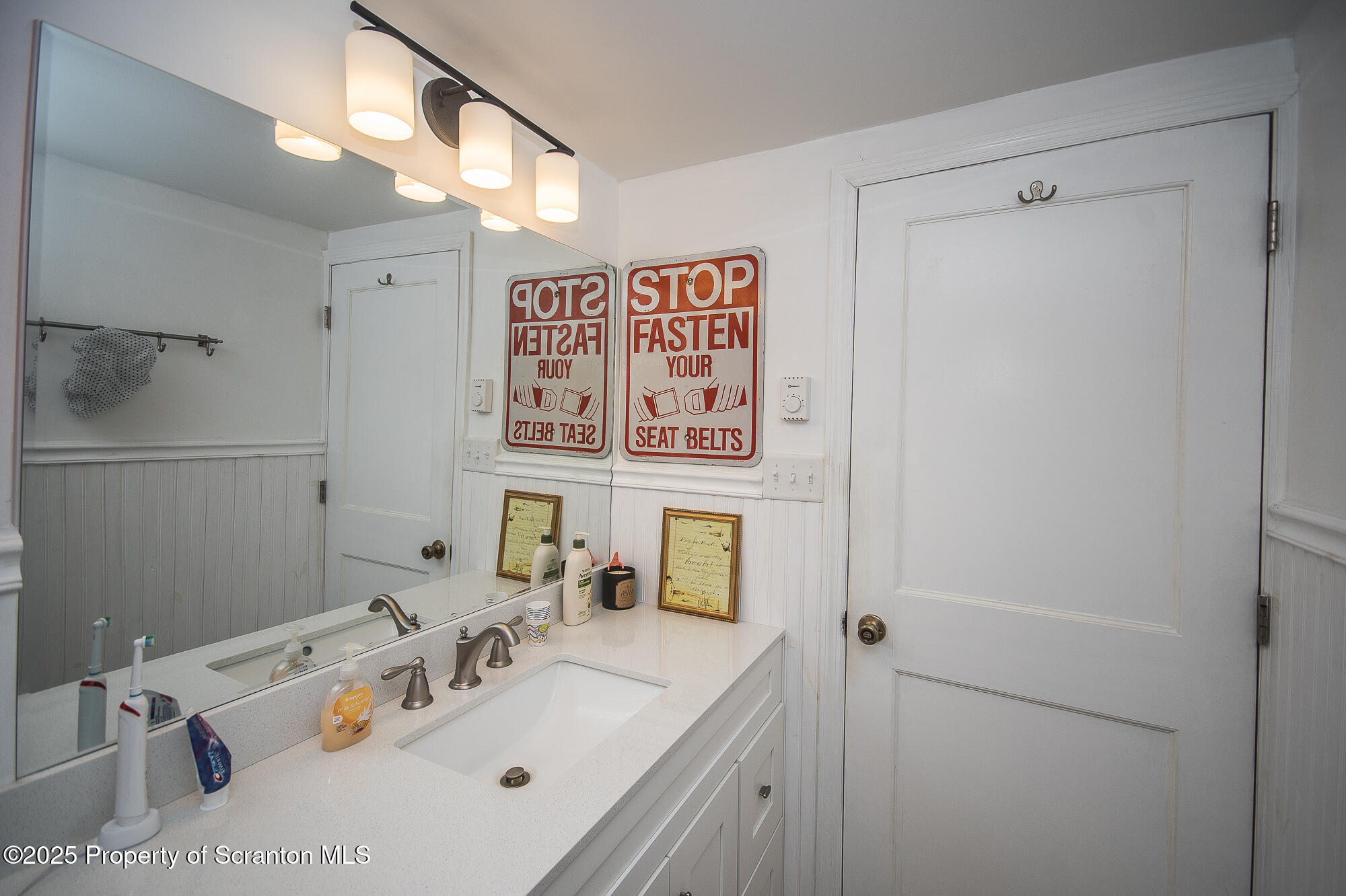 260 Baylors Lake Road Fleetville, PA 18420 - Photo 40 of 69 a bathroom with a sink vanity and mirror