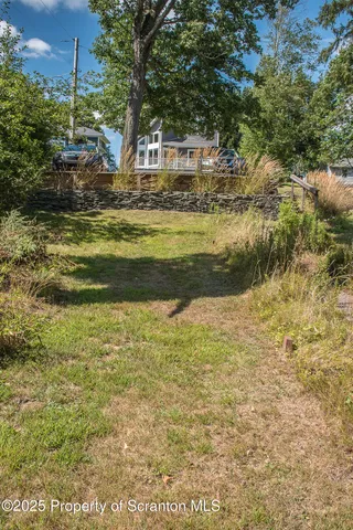 a house with swimming pool in front of it