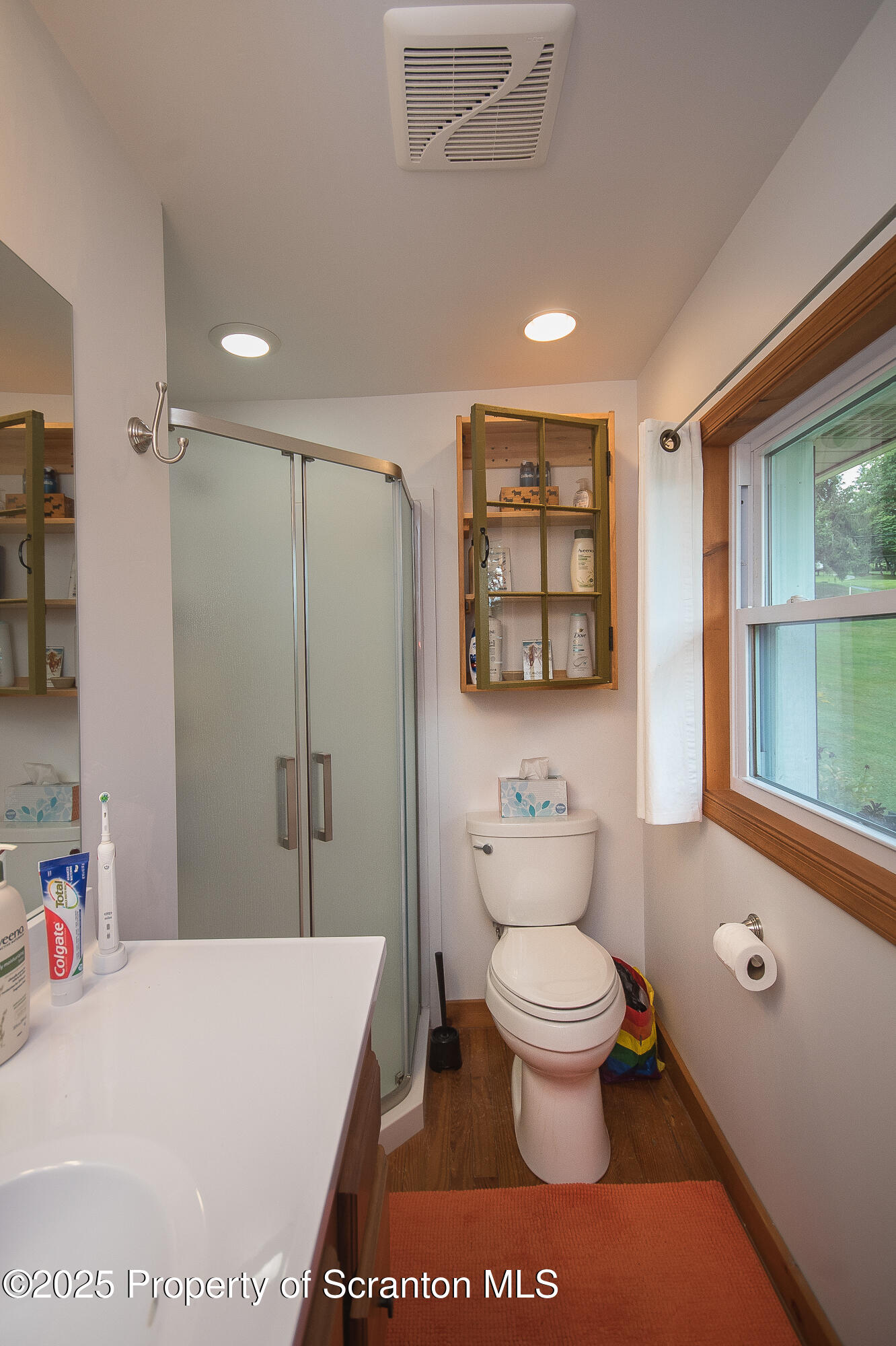 260 Baylors Lake Road Fleetville, PA 18420 - Photo 44 of 69 a bathroom with a toilet sink and mirror