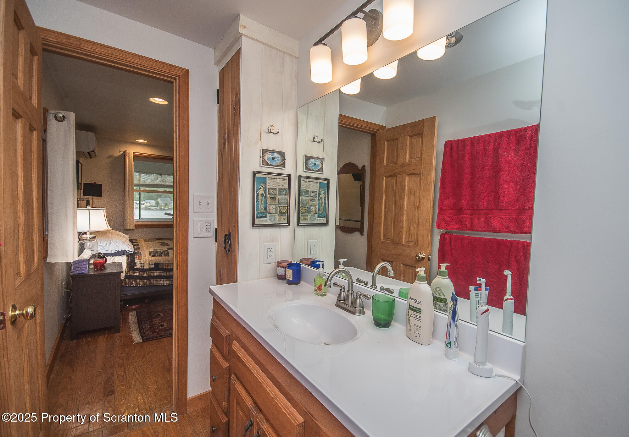 260 Baylors Lake Road Fleetville, PA 18420 - Photo 46 of 69 a bathroom with a sink a vanity and a mirror