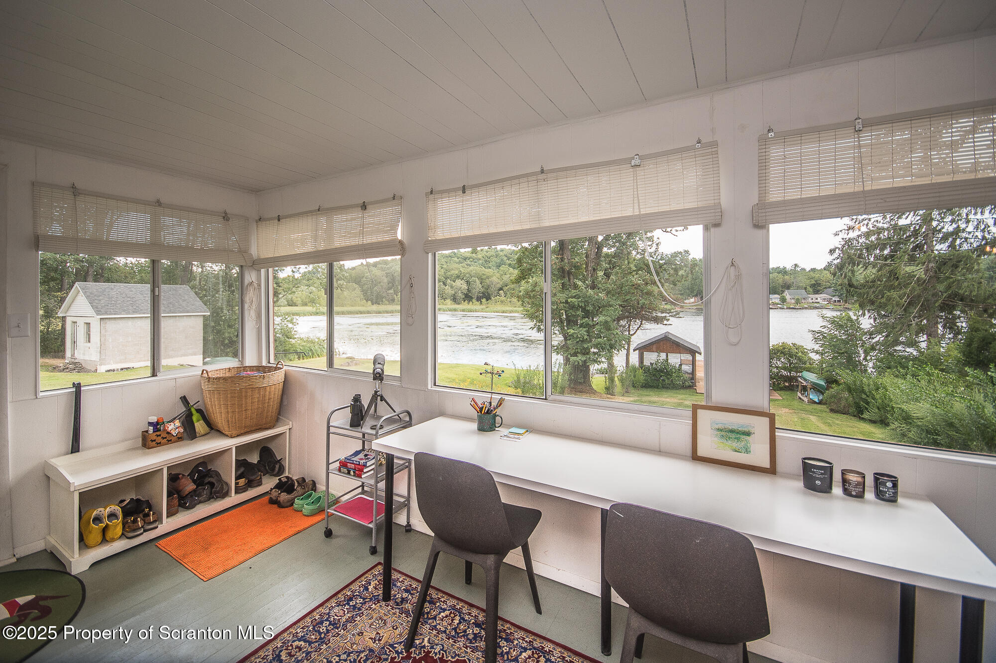 260 Baylors Lake Road Fleetville, PA 18420 - Photo 49 of 69 a reading room with furniture and a floor to ceiling window
