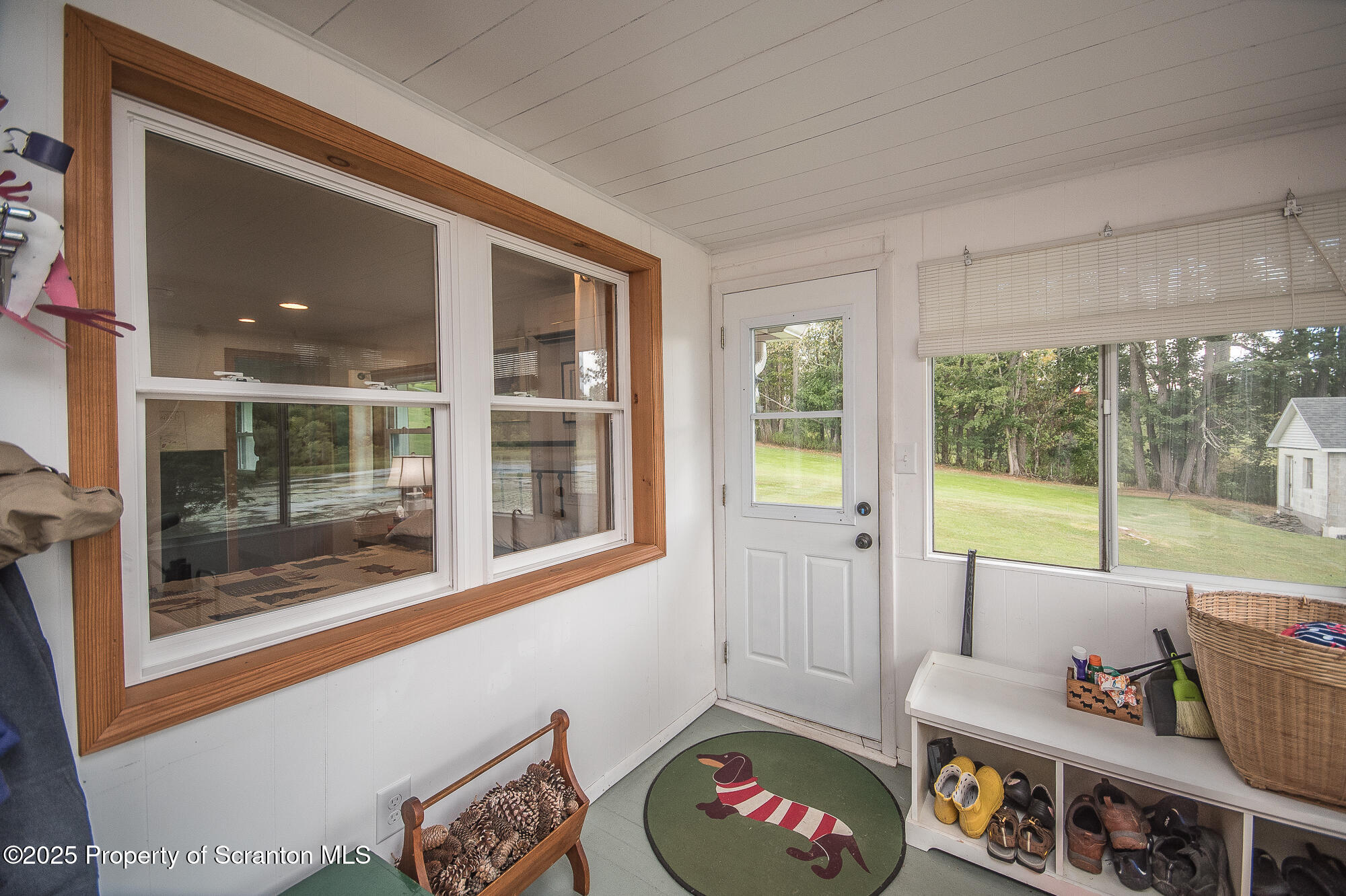 260 Baylors Lake Road Fleetville, PA 18420 - Photo 50 of 69 a living room with furniture and a floor to ceiling window