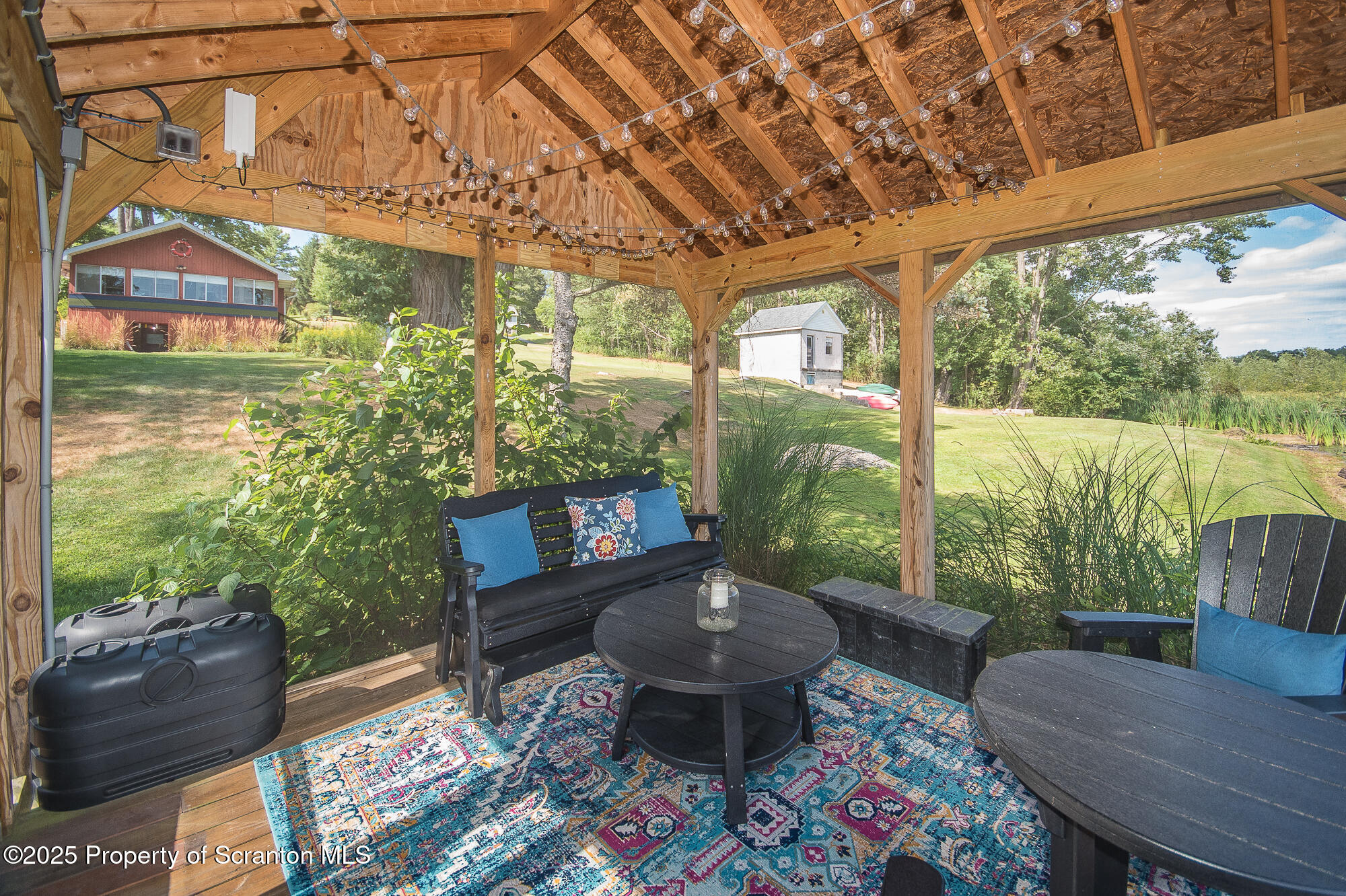 260 Baylors Lake Road Fleetville, PA 18420 - Photo 6 of 69 a outdoor living space with furniture and garden view
