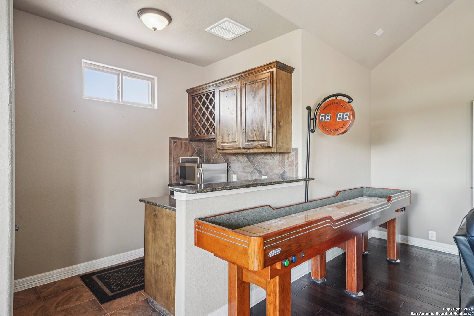 718 Ruidosa Downs Helotes, TX 78023 - Photo 32 of 50 a view of a kitchen with a table and a stove