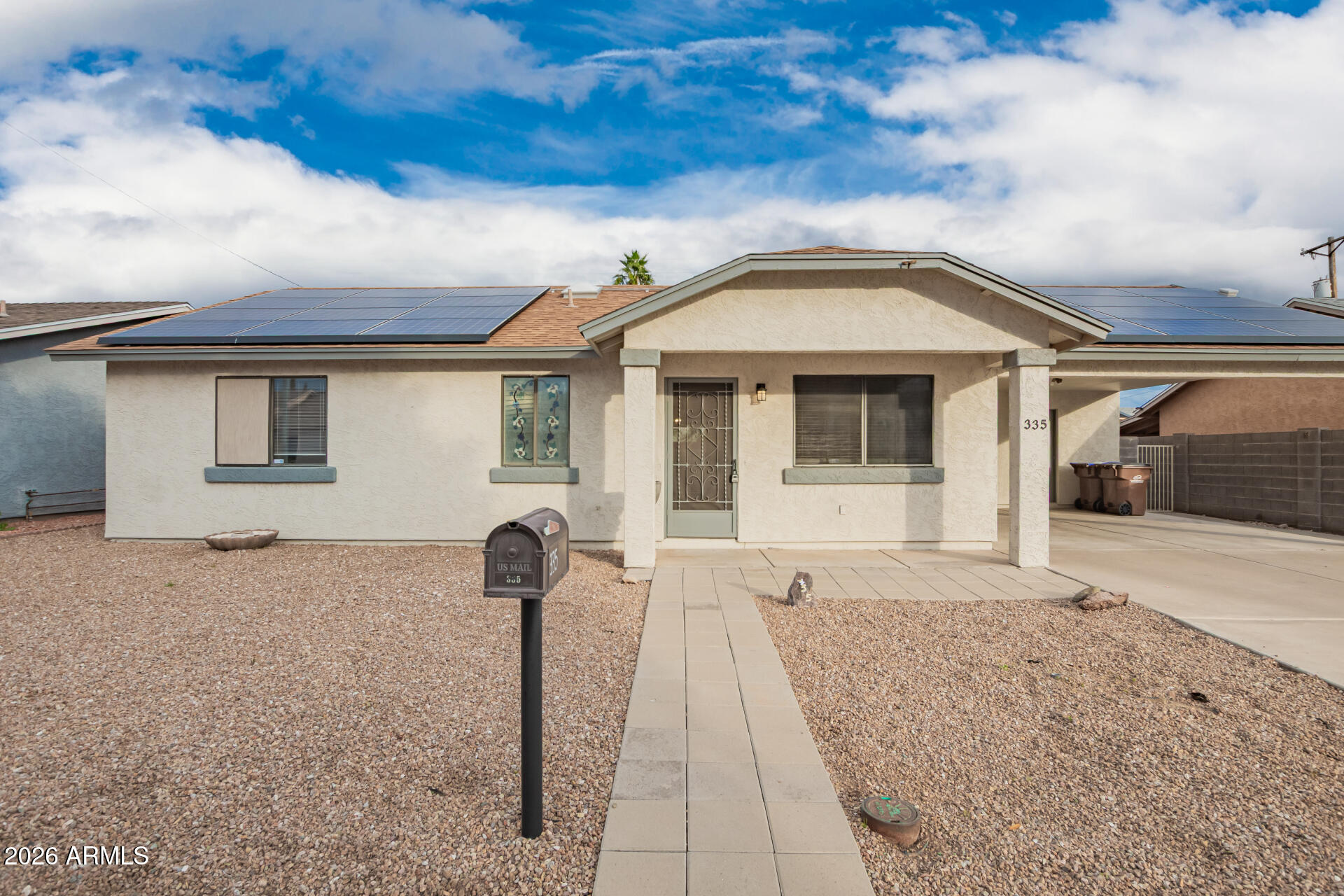 335 South Stardust Lane Apache Junction, AZ 85120 - Photo 30 of 31 a front view of a house with a yard