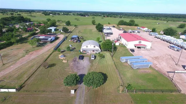 an aerial view of a house with outdoor space