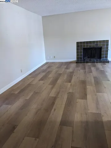 an empty room with a fireplace