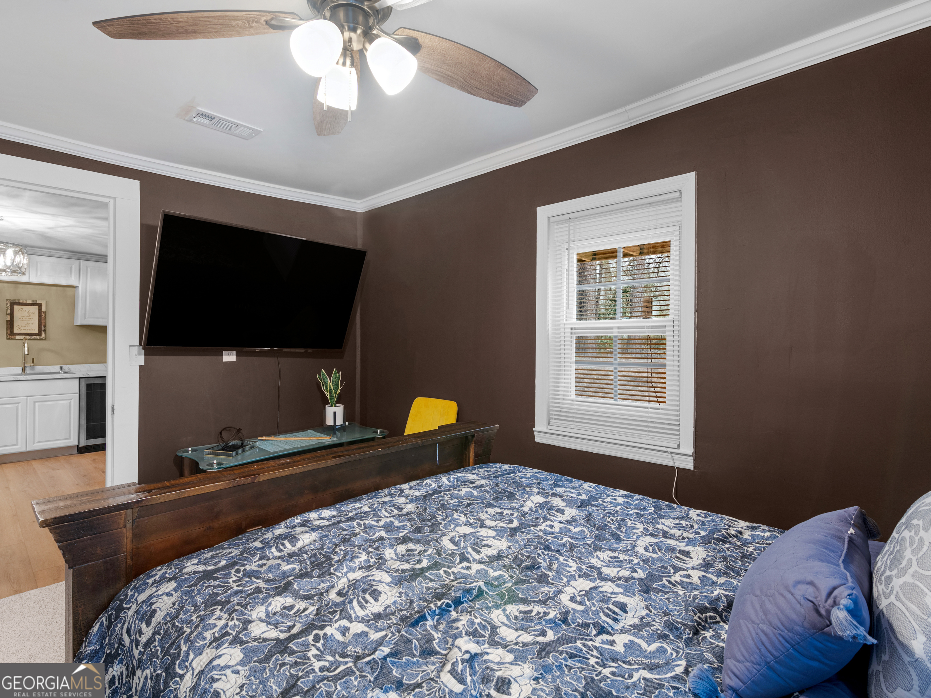 149 Akins Street Barnesville, GA 30204 - Photo 14 of 27 a bedroom with a bed and a flat screen tv