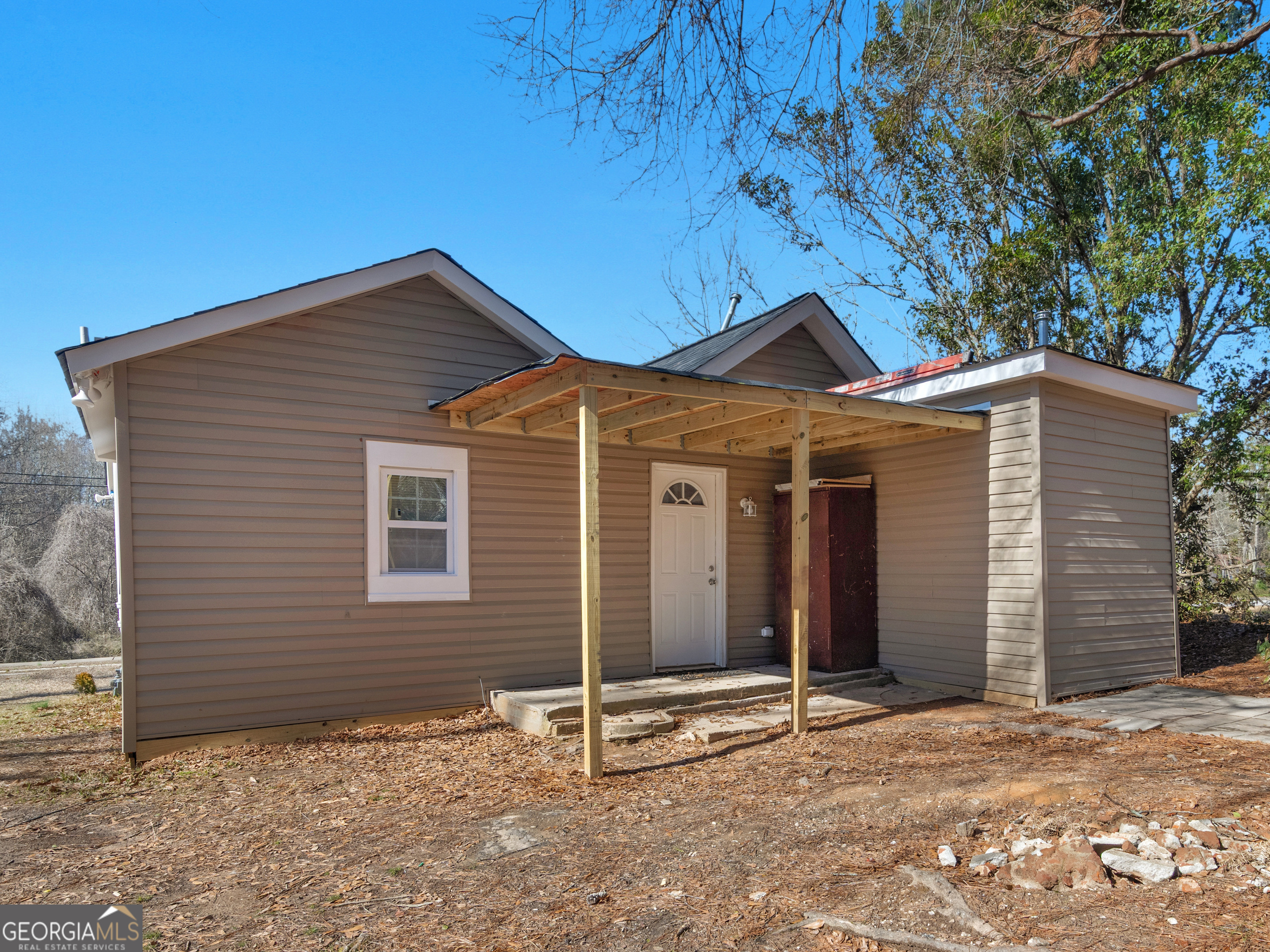 149 Akins Street Barnesville, GA 30204 - Photo 20 of 27 a front view of a house with a garage
