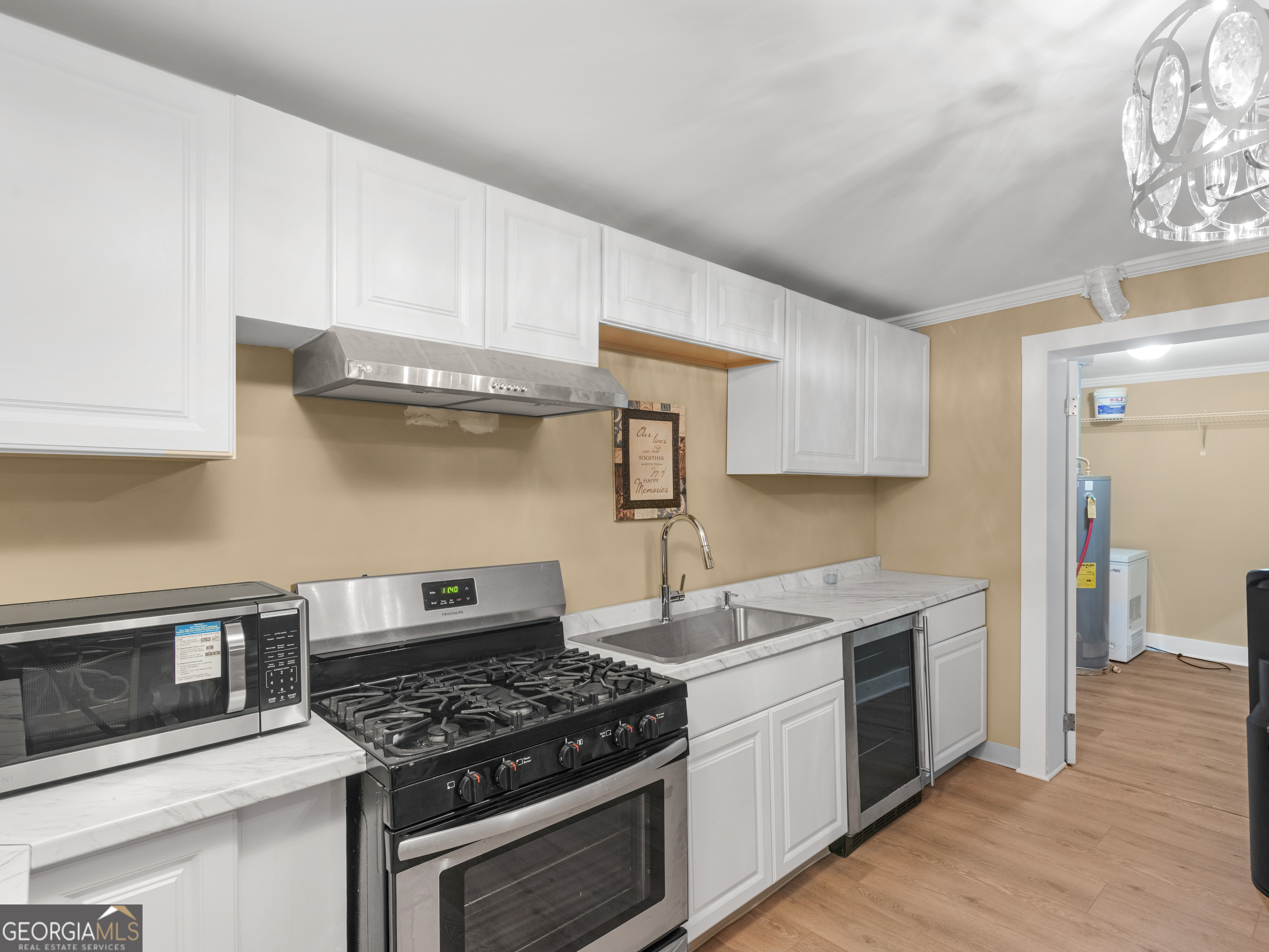 149 Akins Street Barnesville, GA 30204 - Photo 8 of 27 a kitchen with granite countertop a stove and a sink