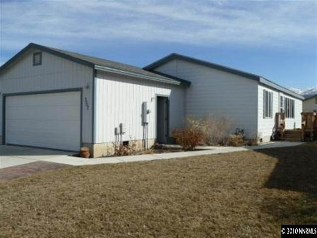 357 Rue De Lane Sparks, NV 89434 - Photo 1 of 7 a front view of a house with a yard