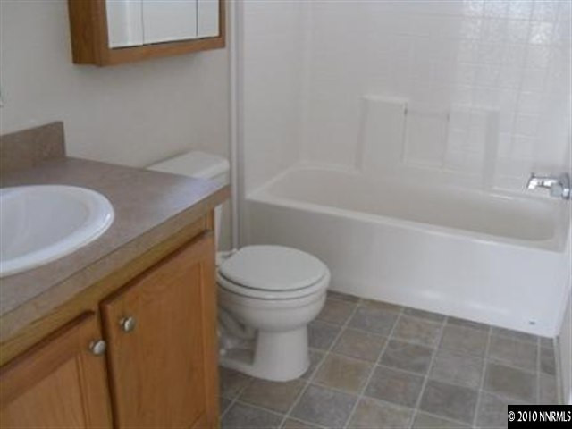 357 Rue De Lane Sparks, NV 89434 - Photo 3 of 7 a bathroom with a sink a toilet and bathtub
