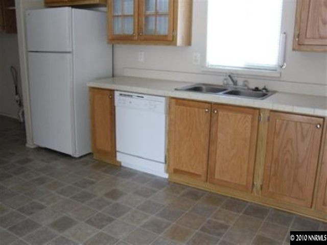 357 Rue De Lane Sparks, NV 89434 - Photo 5 of 7 a kitchen with a sink and cabinets
